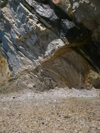 Rock formation at the bottom of a mountain stream in the mountains.の写真素材