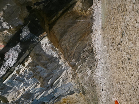 Interior of a cave with a hole in the rock wall.の写真素材
