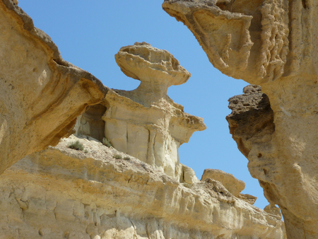 The Erosions of Bolnuevo, Spain. Yellow stones with blue sky in the background.の写真素材