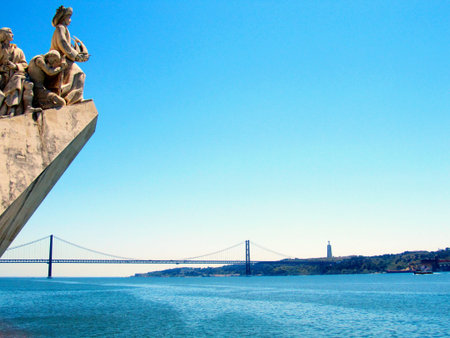 Monument to the Discoveries and 25th of April Bridge, Lisbon, Portugalのeditorial素材