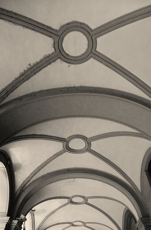 A stone ceiling of the ancient monumental arcades of Turin in Italy. Sepia effect applied.のeditorial素材