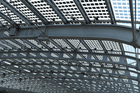 A modern and futuristic grey ceiling made with steel and glass; suitable to be used like background.