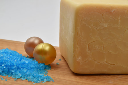 Concept for treatment in a thermal spa: relaxing bath with natural soap, bath salts and a candle.の写真素材