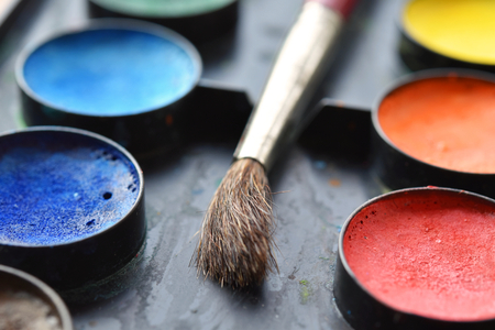 Watercolors palette with a brushの写真素材