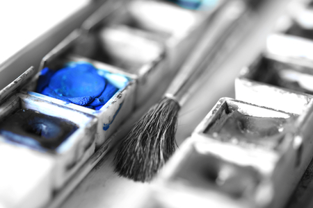 Box of watercolors with a brush. Selective Color applied.の写真素材