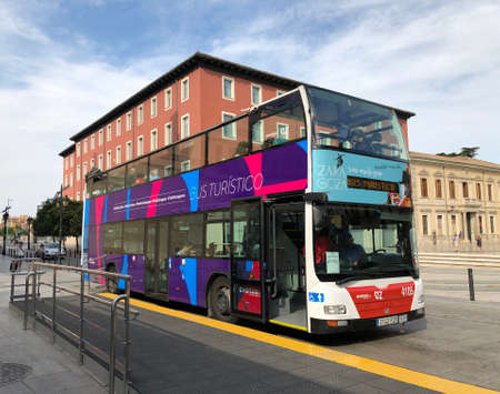A colorful tourist bus in a street of Zaragoza in Spainのeditorial素材