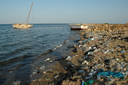 Environment of the Red Sea. Mountains of garbage on the beach away from the resort towns of Egyptの写真素材