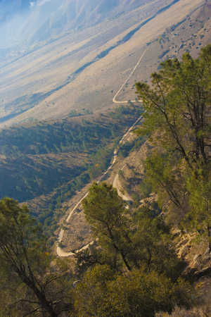 Mountain pass, from which the clouds over the valley can be seen, in the Sierra Nevada, California, USA. The Sierra Nevada is a mountain range in the Western United States.の写真素材