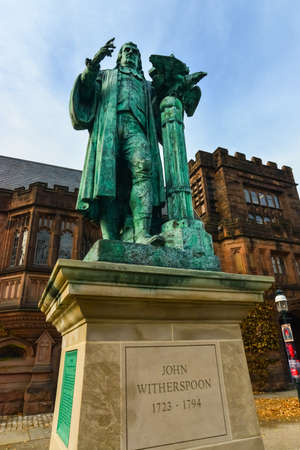 PRINCETON, NJ USA - NOVENBER 12, 2019: View of the facade of East Pyne Building and a statue of Princeton University President John Witherspoon on the Princeton University campus, NJ USAのeditorial素材