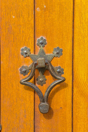 PRINCETON, NJ USA - NOVENBER 12, 2019: forged door elements on the door to Chapel on the campus of Princeton University in Princeton, New Jerseyのeditorial素材