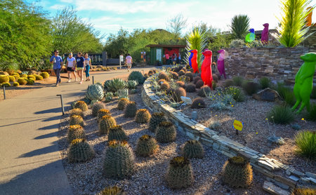 USA, PHENIX, ARIZONA- NOVEMBER 17, 2019: multi-colored plastic animal figures among cacti of different species in the botanical garden of the Phoenix, Arizonaのeditorial素材