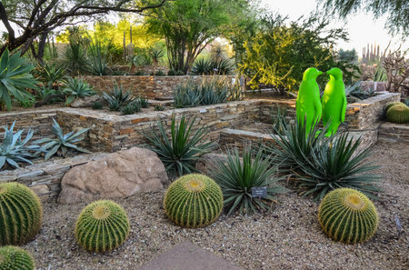 USA, PHENIX, ARIZONA- NOVEMBER 17, 2019: multi-colored plastic animal figures among cacti of different species in the botanical garden of the Phoenix, Arizonaのeditorial素材