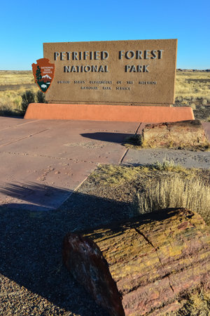 USA, PHENIX, ARIZONA- NOVEMBER 17, 2019: information sign with the name of the park Petrified Forest National Park, Arizonaのeditorial素材