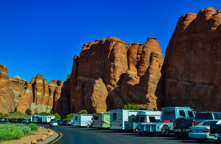 UTAH, USA - MAY 08, 2018: - Eroded landscape, car parking in Arches National Park, Moab, Utah, USA