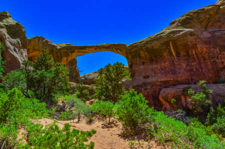 Oblique view of Double O Arch. Arches National Park, Utah, MOAB, USAの写真素材