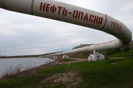 The inscription on the pipe is oil-dangerous. ecological problem. Pipe for pumping oil and gas....