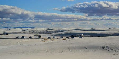 USA, NEW MEXICO - NOVEMBER 23, 2019: Desert landscape of gypsum dunes, tourist cars among sand dunes in White Sands National Monument in New Mexico, USAの写真素材