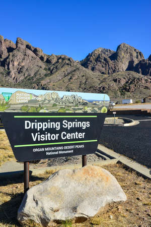 USA, NEW MEXICO - NOVEMBER 23, 2019: "Dripping Springs Visitor Center" sign against a mountain landscape near a park visitor center, New Mexicoのeditorial素材