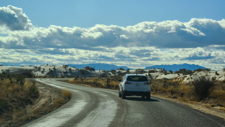 USA, NEW MEXICO - NOVEMBER 23, 2019: car rides the harms of sand dunes from gypsum to White Sands National Monument, New Mexico, USAのeditorial素材