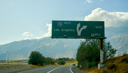 CALIFORNIA, USA - NOVEMBER 27, 2019: Los Angeles road information sign against the backdrop of the mountains in Californiaのeditorial素材