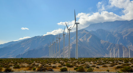 View of wind turbines generating electricity. Huge array of gigantic wind turbines spreading over...