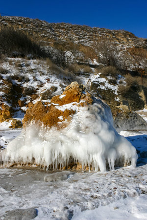 The Black Sea frost, ice covered the coastal stones. climate change, harsh winterの写真素材