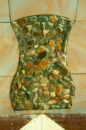 EGYPT, MARSA ALAM-FEBRUARY 24, 2019: installation in the form of a jug of colored stones in the interior of a wall in Egyptのeditorial素材