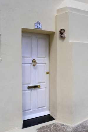 VALLETTA, MALTA - SEPTEMBER 14, 2012: view of a traditional Maltese door on old buildings with a hammer handle in Valletta on the island of Maltaのeditorial素材