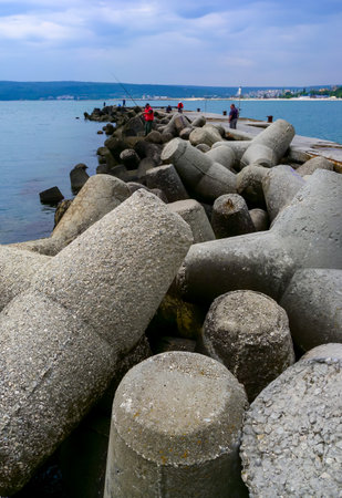 BULGARIA, VARNA - JUNE 06, 2013: coast protection structures, pier and concrete tetrahedrons for storm protection and pier destruction, Bulgariaのeditorial素材