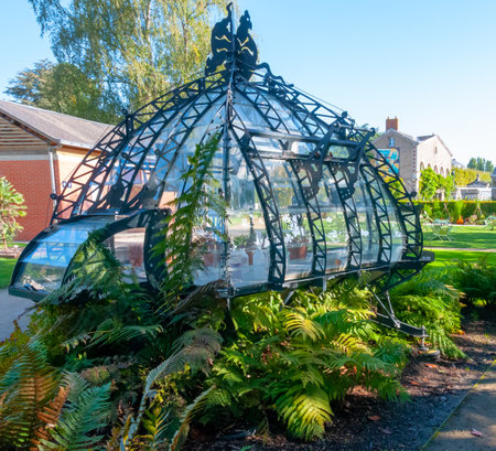 NANTES, FRANCE - SEPTEMBER 12, 2017: An original greenhouse near an artificial lake in a botanical garden in Nantes, Franceのeditorial素材