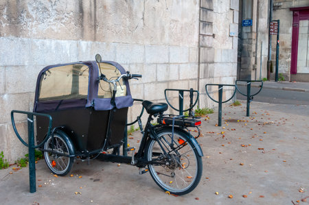 NANTES, FRANCE - SEPTEMBER 12, 2017: tricycle for riding tourists in a parking lot in the city of Nantes, Franceのeditorial素材