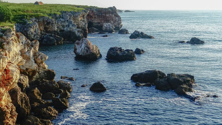 High inaccessible coastal cliffs made of shell rock near the village of Tyulenovo, southern Bulgariaの写真素材