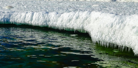 Frozen Black Sea, blocks of melting ice on the seashoreの写真素材