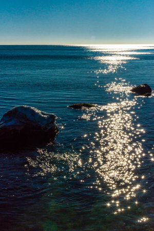 Reflection of the sun in the water in the Black sea, Odessaの写真素材