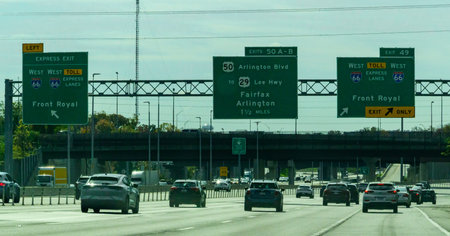 Virginia, USA - November 02, 2025: This is a view of I-66 Westbound traffic in Virginia approaching the exit for Front Royal. The highway features express lanes that utilize dynamic tolling, where prices fluctuate based on real-time traffic demand. Driver