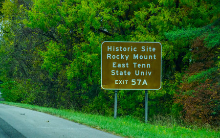 Tennessee, USA - November 03, 2025: This road sign directs traffic to the Rocky Mount State Historic Site, which served as the first capital of the Southwest Territory from 1790 to 1792. It also points toward East Tennessee State University, a public univ