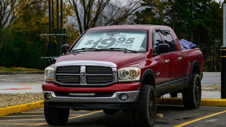 Tennessee, USA - November 03, 2025: a Dodge Ram 3500, specifically a diesel model equipped with a lift kit and off-road tires. It is available for rental or sale, advertised in some locations for around $19.95 for in-town usage.
