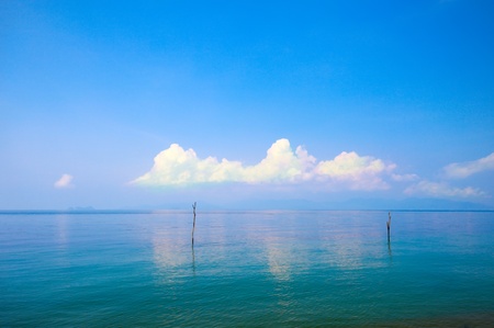 Beautiful sea and cloudy sky with sunの写真素材