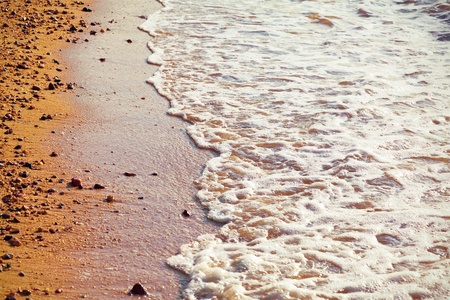 sand and wave background at sunset timeの写真素材
