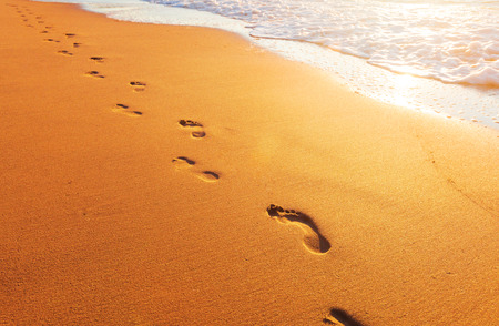 beach, wave and footprintsの写真素材