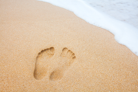 beach, wave and footprintsの写真素材