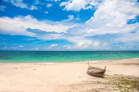 beach and fishing boat, koh Lanta, Thailandの写真素材