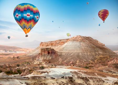 Hot air balloon flying over Cappadocia, Turkeyの写真素材