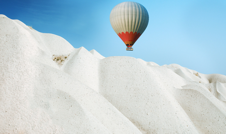 Hot air balloon flying over Cappadocia, Turkeyの写真素材