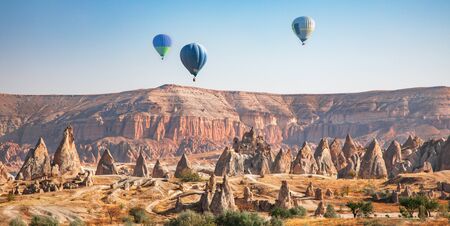Hot air balloon flying over Cappadocia, Turkeyの写真素材