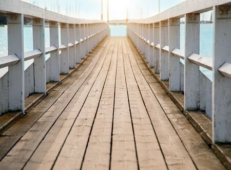 beautiful wooden pier at sunset timeの写真素材