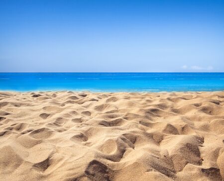 Background of tropical beach and blue sea and sky with white cloudの写真素材