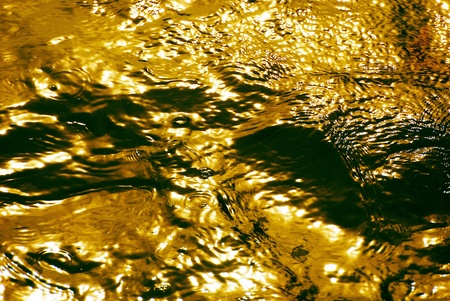 The reflection of sunset over the waterの写真素材