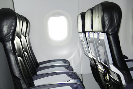 Airplane seat and window inside an aircraftのeditorial素材