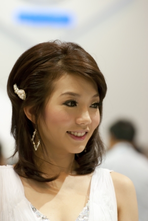 BANGKOK, THAILAND - DECEMBER 4  Unidentified female presenter at the booth in THE THAILAND INTERNATIONAL MOTOR EXPO 2009 on December 4, 2009 in Bangkok, Thailand のeditorial素材